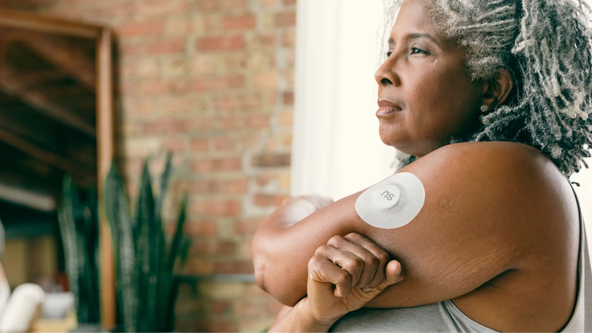 elderly woman smart health patch heart rhythm slee