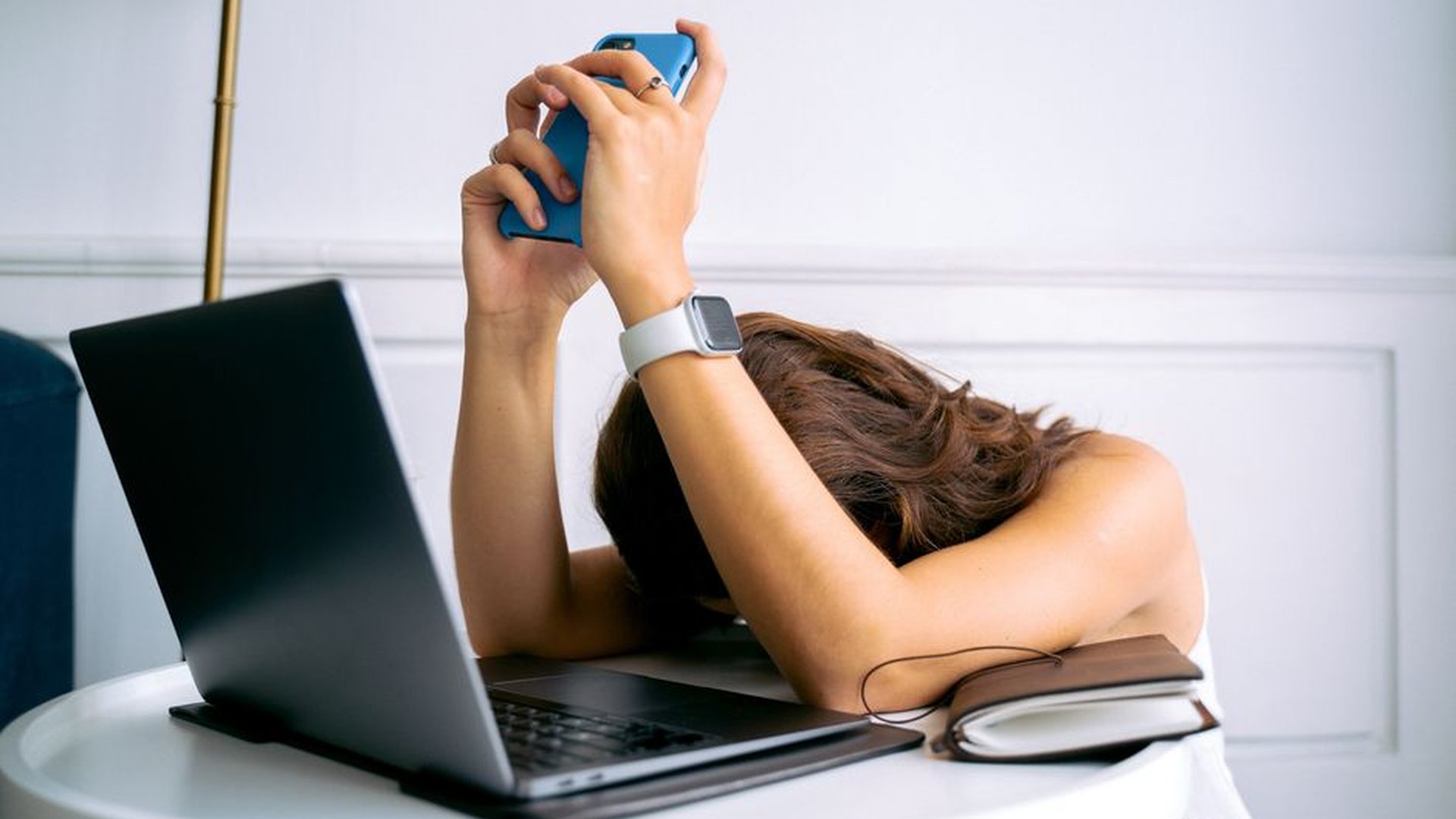 smartwatch ECG reading woman tired office window r